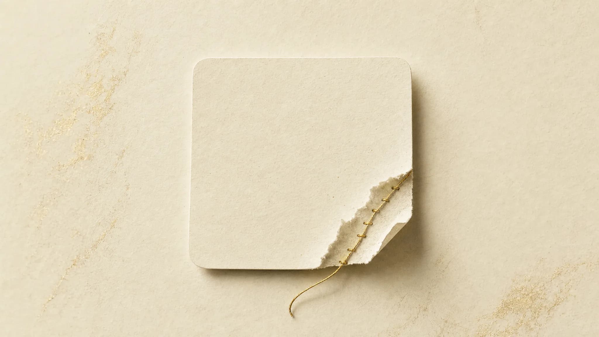A cream calendar page with one date square torn slightly open, a thin antique gold thread stitched around the tear as if mending the gap left behind.